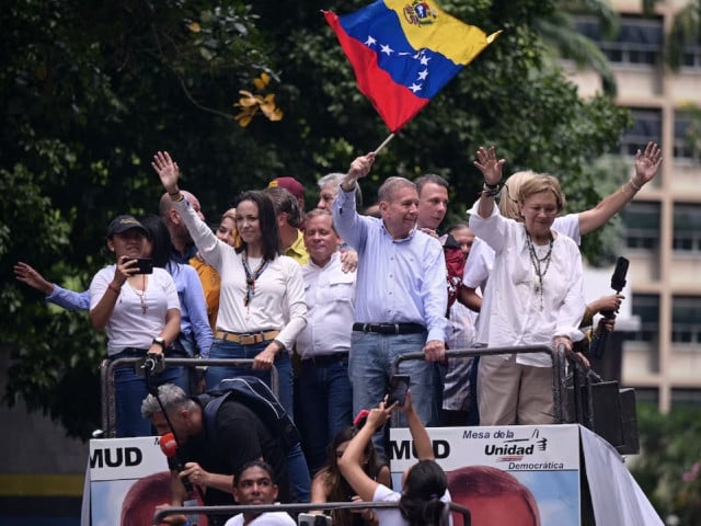 opposition leader maria corina machado and opposition candidate edmundo gonzalez wave as they address supporters after election results awarded venezuela s president nicolas maduro with a third term in caracas venezuela july 30 2024 photo reuters